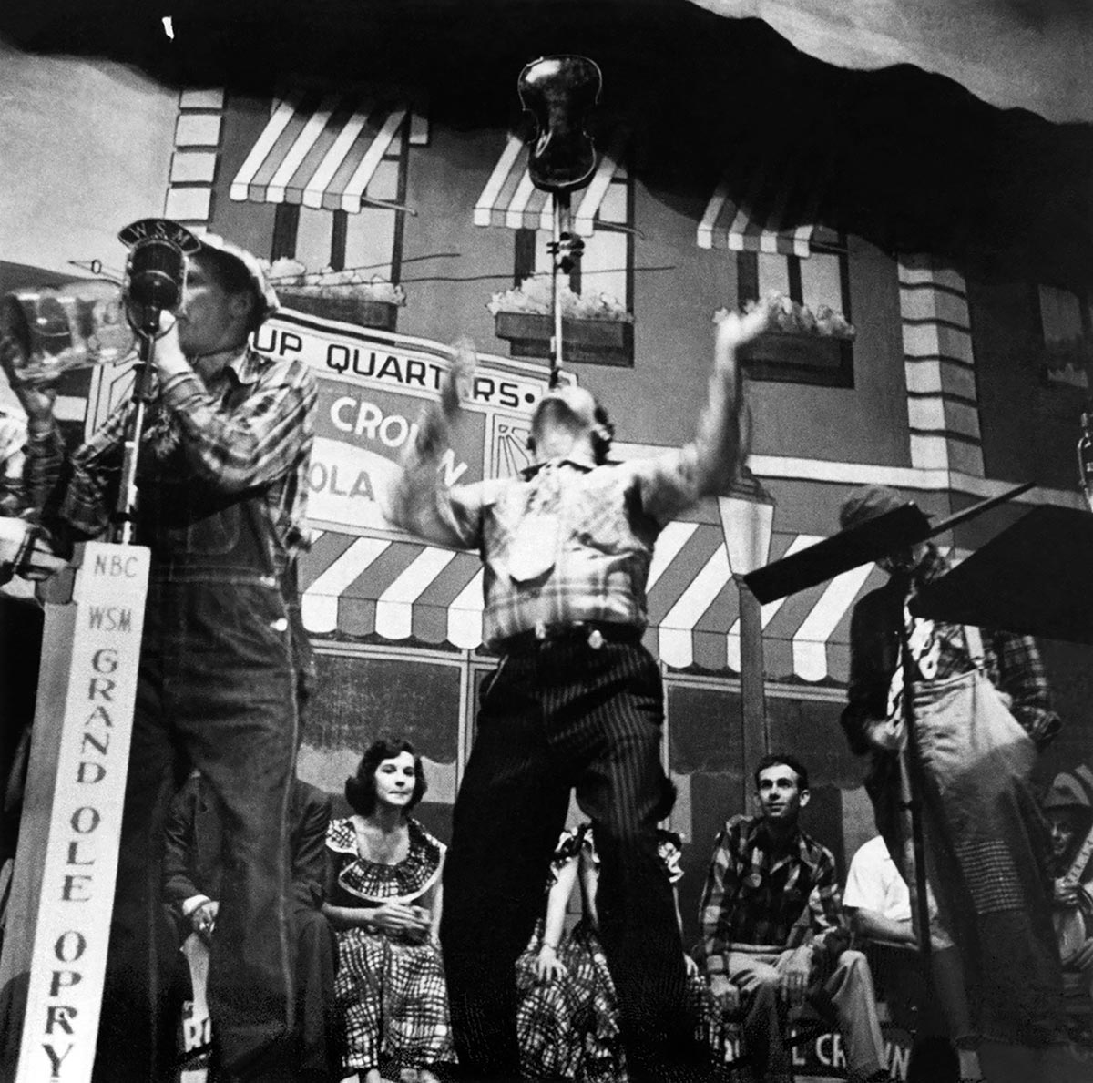 Roy Acuff balances a fiddle on his chin